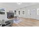 Cozy living room featuring natural light, a fireplace, and stylish decor at 123 E Weatherspoon St, Sanford, NC 27330