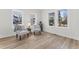 Living room featuring two light gray chairs, wood grain flooring, and lots of natural light at 123 E Weatherspoon St, Sanford, NC 27330