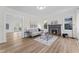 Bright living room with hardwood floors, fireplace, and a seamless flow to other living areas at 123 E Weatherspoon St, Sanford, NC 27330