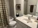 Functional bathroom with a tiled shower, updated fixtures, and a neutral color scheme at 12409 Angel Vale Pl, Durham, NC 27703