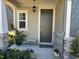 Inviting front door with colorful flowers and stone accents on the exterior of the home at 12409 Angel Vale Pl, Durham, NC 27703