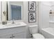 Clean bathroom featuring updated single vanity and bathtub at 158 Holton St, Smithfield, NC 27577