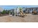 Community playground featuring a modern white and tan playset with slides, climbing structures, and safety mulch at 158 Holton St, Smithfield, NC 27577
