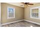 Cozy bedroom featuring neutral walls, hardwood floors, and plenty of natural light at 1721 Raleigh Rd, Henderson, NC 27536