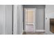 Hallway with new laminate floors and gray painted walls leading to other rooms at 1721 Raleigh Rd, Henderson, NC 27536