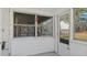 Cozy enclosed porch featuring white trim and windows offering outdoor views at 1721 Raleigh Rd, Henderson, NC 27536