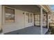Outdoor porch showcasing white siding and a view of the neighborhood at 1721 Raleigh Rd, Henderson, NC 27536