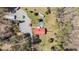 Expansive aerial view of a home featuring a red roof, pool, and surrounding greenery at 1796 Steel Bridge Rd, Sanford, NC 27330