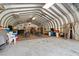 Spacious barn area featuring concrete floors, ceiling fans, and ample room for entertaining at 1796 Steel Bridge Rd, Sanford, NC 27330