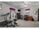 Large finished basement featuring exercise equipment, desk, and a TV at 1796 Steel Bridge Rd, Sanford, NC 27330