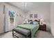 Cozy bedroom with a large window, a comfortable bed, and tasteful decor at 1796 Steel Bridge Rd, Sanford, NC 27330