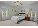 Inviting bedroom with large windows, classic decor, and comfortable furnishings at 1796 Steel Bridge Rd, Sanford, NC 27330