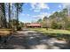 Exterior view of property along a graveled driveway at 1796 Steel Bridge Rd, Sanford, NC 27330