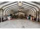 Large metal outbuilding with overhead lighting and concrete floor at 1796 Steel Bridge Rd, Sanford, NC 27330