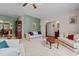 A spacious living room features classic furnishings, neutral carpet, and easy access to the dining room at 1796 Steel Bridge Rd, Sanford, NC 27330
