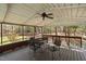 Covered wooden porch with ceiling fan, perfect for enjoying the outdoors at 1796 Steel Bridge Rd, Sanford, NC 27330