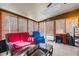 Relaxing sunroom with wicker furniture, sun shades, and a skylight at 1796 Steel Bridge Rd, Sanford, NC 27330