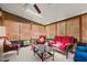 Bright sunroom with wicker seating, blinds, and a ceiling fan, perfect for relaxation at 1796 Steel Bridge Rd, Sanford, NC 27330