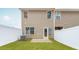 Well-maintained backyard with new fence, small patio, and green grass at 1802 Brim Dr, Haw River, NC 27258