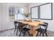 Dining room featuring black chairs, light-colored wood table and hardwood flooring at 1802 Brim Dr, Haw River, NC 27258