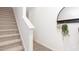 Bright entryway features luxury vinyl plank flooring and leads to carpeted stairs at 1802 Brim Dr, Haw River, NC 27258
