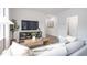 Comfortable living room featuring a tv, neutral decor, and hardwood floors at 1802 Brim Dr, Haw River, NC 27258