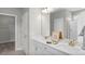 Bright bathroom featuring double sink vanity, framed mirror, and modern lighting at 199 Pretty Run Branch Lane, Wendell, NC 27591