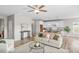 Cozy living room with hardwood flooring and neutral walls is open to the kitchen and dining room at 199 Pretty Run Branch Lane, Wendell, NC 27591