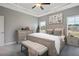 Serene main bedroom featuring neutral decor, a comfortable bed, and natural light from large windows at 199 Pretty Run Branch Lane, Wendell, NC 27591