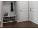 Functional mudroom boasts built-in storage, coat hooks, and a convenient bench for seamless organization at 2007 Trident Maple Ln, Chapel Hill, NC 27517
