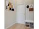 A welcoming entryway featuring a bench with storage, coat hooks, and stylish artwork at 2009 Trident Maple Ln, Chapel Hill, NC 27517