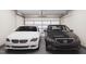 Two-car garage featuring a white car and black car at 2009 Trident Maple Ln, Chapel Hill, NC 27517