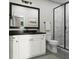 Modern bathroom with a sleek black framed mirror, marble walk-in shower and white cabinets at 2027 Trident Maple Ln, Chapel Hill, NC 27517