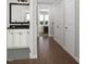 Hallway view to a bathroom with a stylish vanity and access to a bedroom beyond at 2027 Trident Maple Ln, Chapel Hill, NC 27517