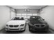 Spacious two-car garage showing parking for two cars with automatic doors and ceiling storage at 2027 Trident Maple Ln, Chapel Hill, NC 27517