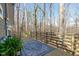 Wood deck with wood railing and view of the wooded backyard at 211 Fleming Dr, Durham, NC 27712