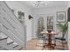 Charming dining room area featuring a modern table setting with a view of the staircase at 211 Fleming Dr, Durham, NC 27712
