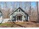 Charming craftsman home with green siding, white trim, and inviting front porch at 211 Fleming Dr, Durham, NC 27712