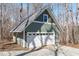Detached garage with a gray roof, green siding, and a white garage door at 211 Fleming Dr, Durham, NC 27712