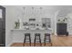 Bright and modern kitchen with a breakfast bar and stainless steel appliances at 211 Fleming Dr, Durham, NC 27712