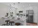 Bright and modern kitchen with a breakfast bar and stainless steel appliances at 211 Fleming Dr, Durham, NC 27712