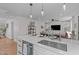 Bright kitchen with a large island, stainless steel appliances, and open layout connecting to the living area at 211 Fleming Dr, Durham, NC 27712