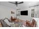 Cozy living room with plush seating, a large TV, and natural light streaming through the windows at 211 Fleming Dr, Durham, NC 27712
