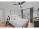 Bright main bedroom with a king bed, light walls, decor, and access to outdoor deck at 211 Fleming Dr, Durham, NC 27712
