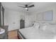 Comfortable main bedroom featuring a king-size bed with white linens, hardwood floors, and ample closet space at 211 Fleming Dr, Durham, NC 27712
