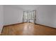 Bedroom with hardwood floors and a window at 2125 W Academy St, Holly Springs, NC 27540