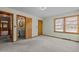 Spacious bedroom with carpet, natural light, and attached bathroom at 2125 W Academy St, Holly Springs, NC 27540