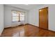 Bedroom with hardwood floors and window at 2125 W Academy St, Holly Springs, NC 27540