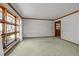 Bright living room with large windows offering natural light and neutral walls and flooring at 2125 W Academy St, Holly Springs, NC 27540