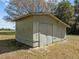 Exterior view of the painted storage shed with double doors at 2125 W Academy St, Holly Springs, NC 27540